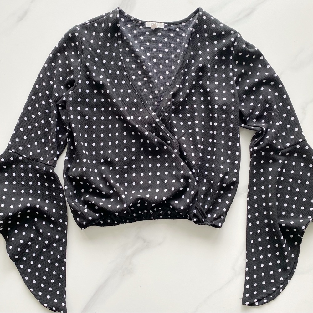 Polka dot black and white surplice blouse
